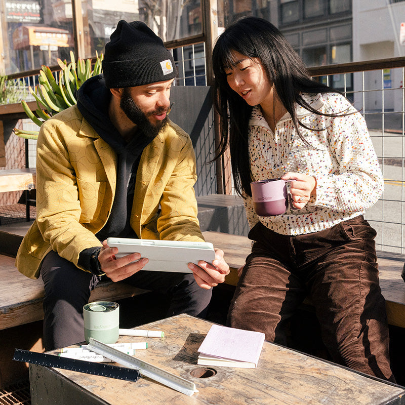 12oz-rise-mug-s3 12oz_rise_coffee_mug_dusty_orchid_couple_city_patio_square.jpg