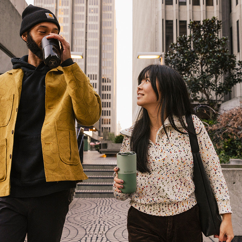 16oz-rise-tumbler-f1 16oz_rise_tumbler_black_iceberg_couple_drink_city_street_square.jpg