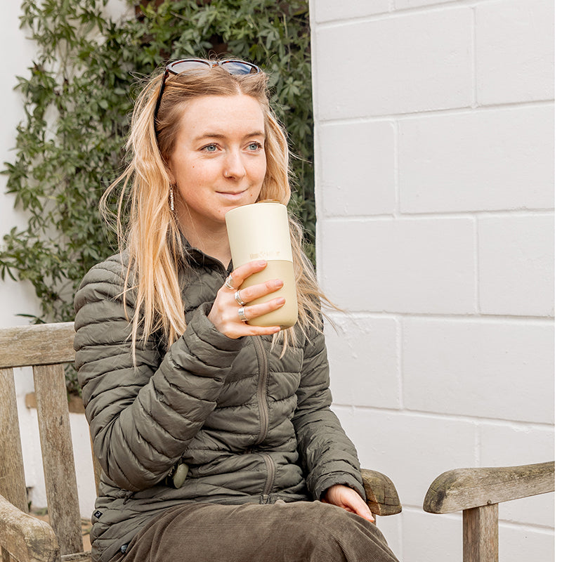 16oz-rise-tumbler-f1 16oz_rise_tumbler_wax_yellow_woman_seat_outside_square.jpg