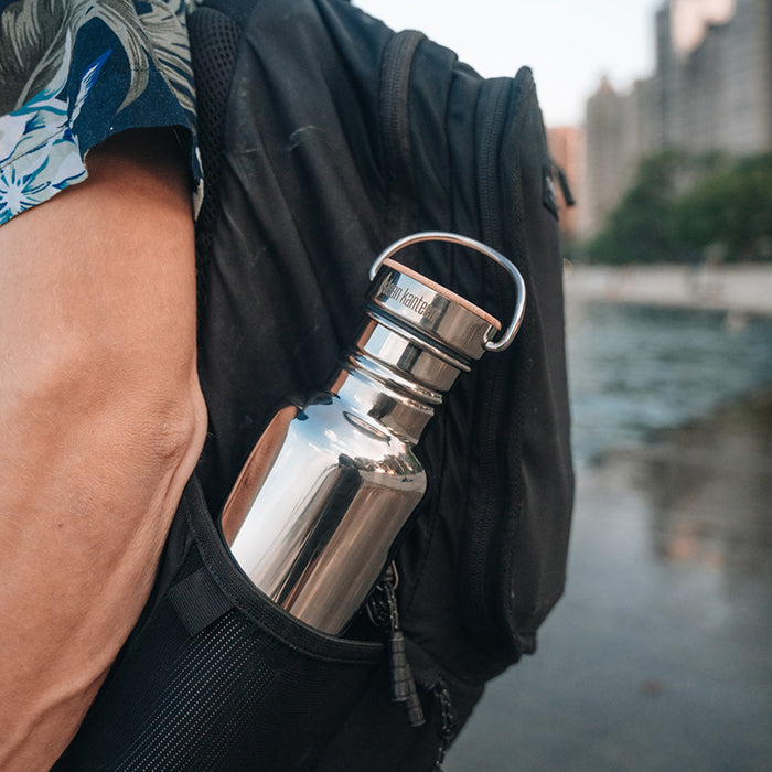 27oz-reflect-with-bamboo-cap-b6 K27SSLRF-MS-BAMBOO_reflect-bottle_backpack_lifestyle.jpg